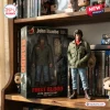 Front view of a Rambo First Blood 45th Anniversary Hot Toys figure standing next to its collectible display packaging.