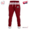 Front view of maroon joggers with white waistband, drawstrings, and a Dolphin graphic.