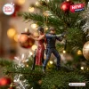 Resident Evil Leon and Ada 30th Anniversary Christmas ornament featuring figures back-to-back with pistols in a tree.
