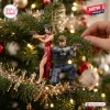 Resident Evil Leon and Ada 30th Anniversary Christmas Ornament featuring detailed action figures on a green tree branch.