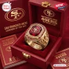 Close-up of a commemorative 80th anniversary ring inside a red velvet-lined collector display box.