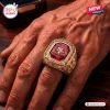 Closeup of a San Francisco 49ers 80th Anniversary commemorative ring worn on a person's finger.