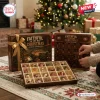 San Francisco 49ers Faithful To The Bay Christmas Advent Calendar with gold ornaments in a box by a lit tree.