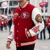 Side angle view of the San Francisco 49ers Football Mascot Baseball Jacket featuring embroidered patches.