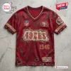 Front view of a red distressed San Francisco 49ers NFL football t-shirt with torn fabric edges and sports graphics.