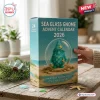 Sea Glass Gnome Advent Calendar 2026 box featuring a teal gnome in a glass globe on a beach scene with pine needles.
