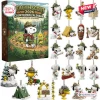 Front view of the Snoopy Beagle Scout 2026 Advent Calendar box alongside twenty-four various hanging character ornaments.