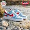 Snoopy Christmas Peanuts Gang Air Force 1 Sneakers featuring blue leather with Snoopy, Woodstock, and red swoosh logos.
