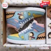 Side view of Snoopy custom name retro comic high top sneakers featuring pastel blue, pink, and yellow panels in a box.