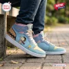 Side view of Snoopy Custom Name Retro Comic High Top Sneakers worn with jeans on a stone path.