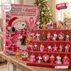 Front view of the Snoopy x Coca-Cola Breast Cancer Awareness Advent Calendar box with hanging acrylic charms.