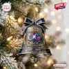 Hanging bell ornament with Star Wars 50th Anniversary graphic and lightsaber duel scene.