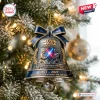 Hanging bell ornament on a tree, featuring a Star Wars 50th Anniversary design with two figures dueling with lightsabers.
