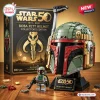 Front view of the Boba Fett Helmet Brick Set with its packaging box and minifigure on a wooden table.