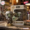 Front view of Grogu in Mandalorian armor vinyl figure standing in front of its 50th anniversary collector box.