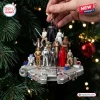 Star Wars Millennium Falcon 2026 Christmas ornament featuring miniature figures of Luke, Vader, Leia, and other characters.