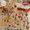 Super Mario Rabbids Kingdom Battle Advent Calendar set featuring numerous small plastic character figures on wooden floor.
