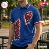 Front view of a blue polo shirt featuring a graphic print of a red and gold emblem with a ripped fabric effect.