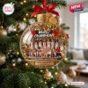 Front view of a clear glass ornament hanging on a tree with a photo of a women's basketball team inside.
