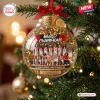 Front view of a clear glass ornament with a Team USA Basketball 2026 World Champions graphic hanging on a Christmas tree.