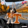 Hanging crochet dog mascot car ornament wearing an orange jersey with a letter T.