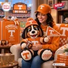 A woman holding a Tennessee Volunteers mascot crocheted plush doll wearing a matching hat and holding a tiny football.