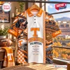 Front view of the Tennessee Volunteers NCAA mascot polo shirt featuring a hound graphic and stadium print.