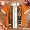 Front view of an orange Tennessee Volunteers Hawaiian shirt featuring a bluetick hound graphic and vertical striped panels.