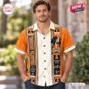 Front view of a man wearing a Tennessee Volunteers orange Hawaiian shirt with hound graphic.