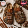 Texas Longhorns Burnt Orange Suede Clogs featuring embossed university logos, football imagery, and Austin Texas lettering.