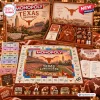 Top-down view of the Texas Longhorns Collector Edition Monopoly board game showing game board, tokens, and box contents.