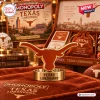 Close-up view of a metal longhorn game piece in front of a Texas Longhorns Collector Edition Monopoly Board Game box.