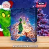 The Grinch 2026 Christmas Advent Calendar features a green Grinch character standing before Whoville on a blue box.