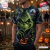 Front view of a person wearing a Grinch Halloween pumpkin shirt with an all-over dark forest graphic design.