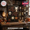 The Horror Element Of Halloween Advent Calendar 2026 box with horror character figurines on a metal rack and oil lamp.