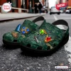 Angle view of The Legend of Zelda Ocarina of Time clogs with charms on a street.