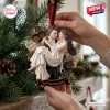 The Phantom of the Opera 40th Anniversary Christmas ornament featuring the Phantom holding Christine against a pine tree.