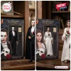 The Phantom of the Opera 40th Anniversary Figure set featuring a masked man in a tuxedo and a woman in a white gown.