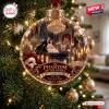 Closeup of The Phantom of the Opera 40th Anniversary Glass Christmas Ornament hanging on a tree.