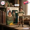 The Wizard of Oz 87th Anniversary Figure Scarecrow doll holding a diploma standing next to its branded display box.