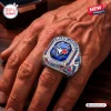 Close-up of a hand wearing a Toronto Blue Jays 50th Anniversary Championship Ring with a blue center stone and metal detail.