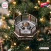Front view of a UFC Championship Octagon Christmas ornament hanging on a pine tree with gloves and a title belt inside.