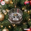 Close-up of a UFC Championship Octagon Christmas ornament featuring gloves and a gold belt inside a fence on a tree.