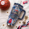 USA Basketball 73rd Anniversary YETI Tumbler Cup with blue tie-dye pattern, gold trophy icons, and straw on white fur.