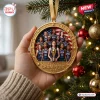 Hand holding a round USA FIBA Women’s World Cup 2026 Champions ornament featuring a basketball team and US flag backdrop.