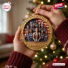 Close-up of a hand holding an oval USA FIBA Women’s World Cup 2026 Champions ornament featuring a basketball team photo.