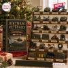 Vietnam Veterans Advent Calendar 2026 featuring 24 miniature military vehicles and memorial items on wooden tiered shelving.