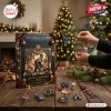 Warhammer 40000 40th Anniversary Advent Calendar black box with golden accents, display ornaments, and holiday lights background.