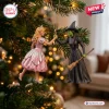 Wicked Glinda and Elphaba Christmas ornament hanging on a pine tree featuring iconic pink gown and black witch outfit.