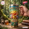 Hand holding Winnie the Pooh Hundred Acre Wood 40oz Stanley Tumbler featuring characters in a forest setting.
